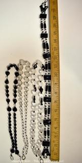 Four (4) Clear and Black Faceted Black Bead Strands. 