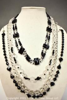 Four (4) Clear and Black Faceted Black Bead Strands. 