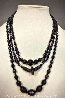 Three (3) Strands of Black Faceted Beads.  