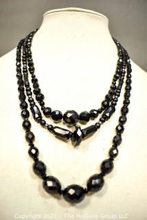 Three (3) Strands of Black Faceted Beads.  