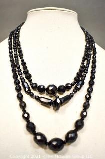 Three (3) Strands of Black Faceted Beads.  