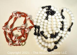 Two (2) Strands of Porce;ain with Red Jasper Beads and White with Black Glass Beads.  They measure 23" and 46".