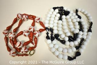 Two (2) Strands of Porce;ain with Red Jasper Beads and White with Black Glass Beads.  They measure 23" and 46".