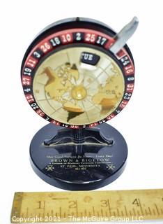 Vintage Brown & Bigelow Roulette Wheel Perpetual Desk Calendar.