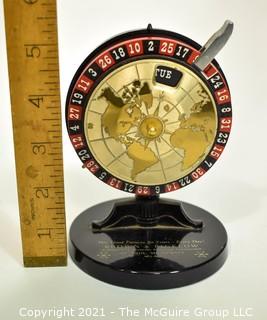 Vintage Brown & Bigelow Roulette Wheel Perpetual Desk Calendar.