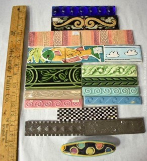 Group of Ceramic Hand Painted Tile Trims Border Pieces in Various Patterns.  Includes one Broken Tile. 