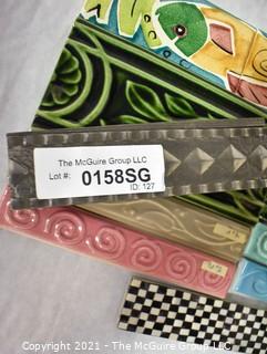 Group of Ceramic Hand Painted Tile Trims Border Pieces in Various Patterns.  Includes one Broken Tile. 