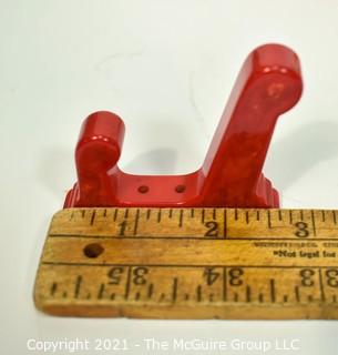 Set of Eight (8) Vintage Bakelite Wall Hooks in Butterscotch and Cherry Red.  Each measures 3" long.