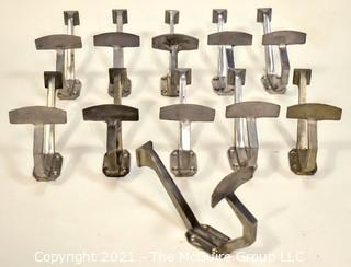 Eleven (11) Aluminum Art Deco Mid Century Wall Hooks.  Each measure 8" long.