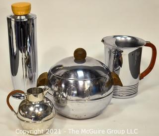 Collection of Mid Century Art Deco Style Chrome Barware.  Includes Chase Tall Cocktail Shaker With Butterscotch Bakelite Top, West Bend Penguin Hot & Cold Server, Bakelite Handled Pitcher and Small Pitcher with Wrapped Handle. 