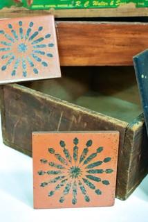 Vintage Ceramics Tiles, 2 Antique Wooden Boxes and Moose Brand Food Crate Label on Plank.