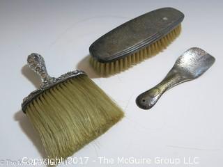 REVISED: 1 Vintage sterling covered brush; 1 silver plated brush, and a sterling shoe horn.  