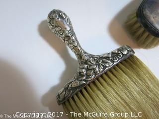 REVISED: 1 Vintage sterling covered brush; 1 silver plated brush, and a sterling shoe horn.  