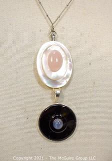 Two (2) Mother of Pearl Pendants. 