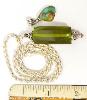 Two Gemstone Pendants Set in Sterling Silver Includes, Turqoise and Green Amber. 