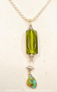 Two Gemstone Pendants Set in Sterling Silver Includes, Turqoise and Green Amber. 