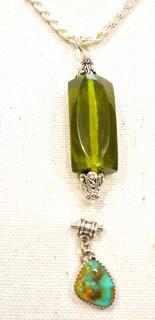 Two Gemstone Pendants Set in Sterling Silver Includes, Turqoise and Green Amber. 