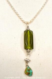 Two Gemstone Pendants Set in Sterling Silver Includes, Turqoise and Green Amber. 