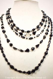 Facetted Clear and Black Glass Bead Necklaces. 