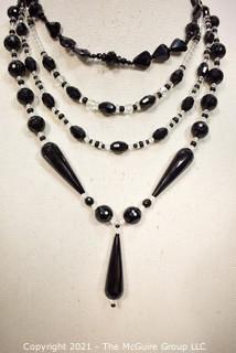 Group of Facetted Clear and Black Glass Bead Necklaces.  They measure 18", 20" & 21" long. 