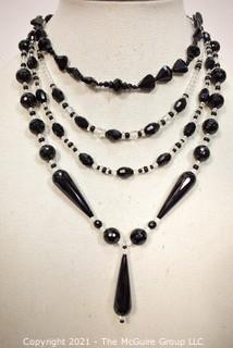 Group of Facetted Clear and Black Glass Bead Necklaces.  They measure 18", 20" & 21" long. 