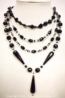 Group of Facetted Clear and Black Glass Bead Necklaces.  They measure 18", 20" & 21" long. 