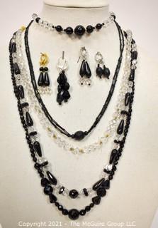 Group of Facetted Clear and Black Glass Bead Necklaces and Matching Earrings. 