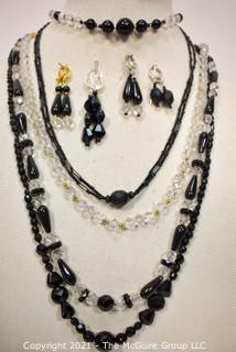 Group of Facetted Clear and Black Glass Bead Necklaces and Matching Earrings. 