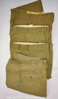 US Marine Corps tan khaki clothing: 4 long sleeve shirts, 5 short sleeved shirts and 4 pair of trousers