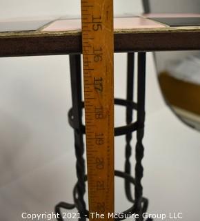 Vintage Wrought Iron Table with Pink and Black Tile Insert. Measures 15" tall and 23" square.