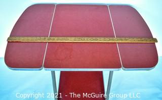 Vintage Mid Century Red  Formica Top Drop Leaf Table with Chrome Trim on Casters. 35" wide when leaves up, 39" tall. Some separation on Formica top. *