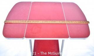 Vintage Mid Century Red  Formica Top Drop Leaf Table with Chrome Trim on Casters. 35" wide when leaves up, 39" tall. Some separation on Formica top. *