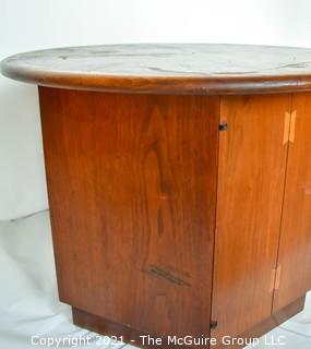 Vintage Mid Century Modern Lane Acclaim Drum Table Designed by Andre Bus with Cabinet in Base. Measures 27″D x 21″T.