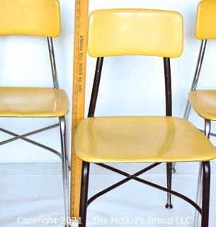 Three (3) Mid Century Modern Heywood Wakefield Woodite Solid Plastic Yellow and Chrome School Chairs. 