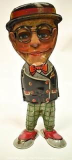 Vintage Harold Lloyd - Louis Marx Walkie Wind Up Tin Toy. Measures 10 1/2" tall. * Missing arms.  
