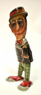 Vintage Harold Lloyd - Louis Marx Walkie Wind Up Tin Toy. Measures 10 1/2" tall. * Missing arms.  
