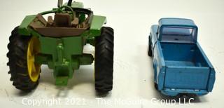 Two (2) Vintage Metal Toy Trucks Including John Deere and Tonka. 