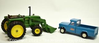 Two (2) Vintage Metal Toy Trucks Including John Deere and Tonka. 