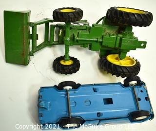 Two (2) Vintage Metal Toy Trucks Including John Deere and Tonka. 