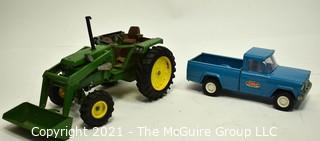 Two (2) Vintage Metal Toy Trucks Including John Deere and Tonka. 