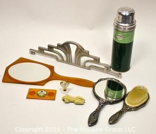 Collection of Art Deco Decorative Items Including Dresser Brush and Hand Mirror Set, One in Butterscotch Bakelite, Chrome Architectural Salvage Piece, Thermos, Toy Car, Ink Stand, and Crystal Globe Clock. 