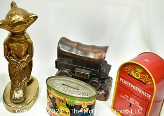 Eclectic Group Including Spy Glass Telescope in Wood Frame, Turkey Candle, Four (4) Vintage Coin Banks, Virginia Brass Fox Bottle Opener, Tin State Puzzle Piece, Blue Glass Decanter, Two Leather Case Tool Cases and Black Metal Bank Box.