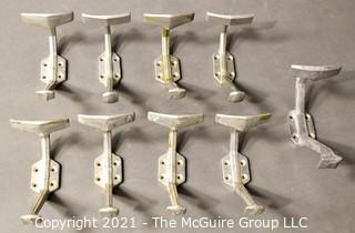 Nine (9) Aluminum Art Deco Mid Century Wall Hooks. Each measure 8" long.