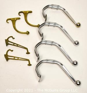 Eight (8) Aluminum and Brass Wall Hooks. Various Lengths.