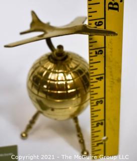 Decorative Brass World Globe with Airplane Attached.  Measures 10" tall. 