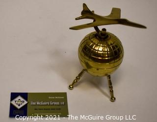 Decorative Brass World Globe with Airplane Attached.  Measures 10" tall. 