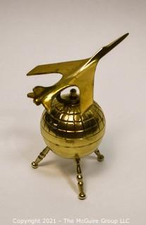 Decorative Brass World Globe with Airplane Attached.  Measures 10" tall. 