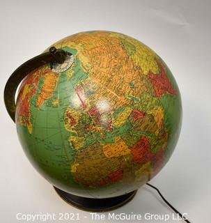 Vintage Illuminated World Globe Lamp and Stand.  Measures 14" tall.