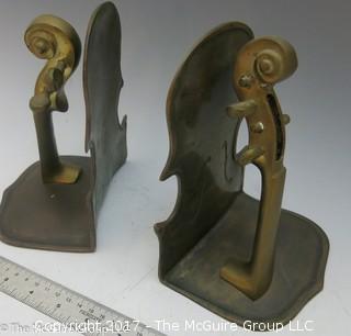 Pair of metal bookends in the form of a violin/cello 