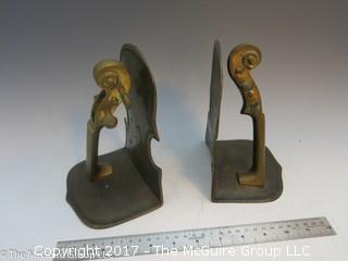 Pair of metal bookends in the form of a violin/cello 